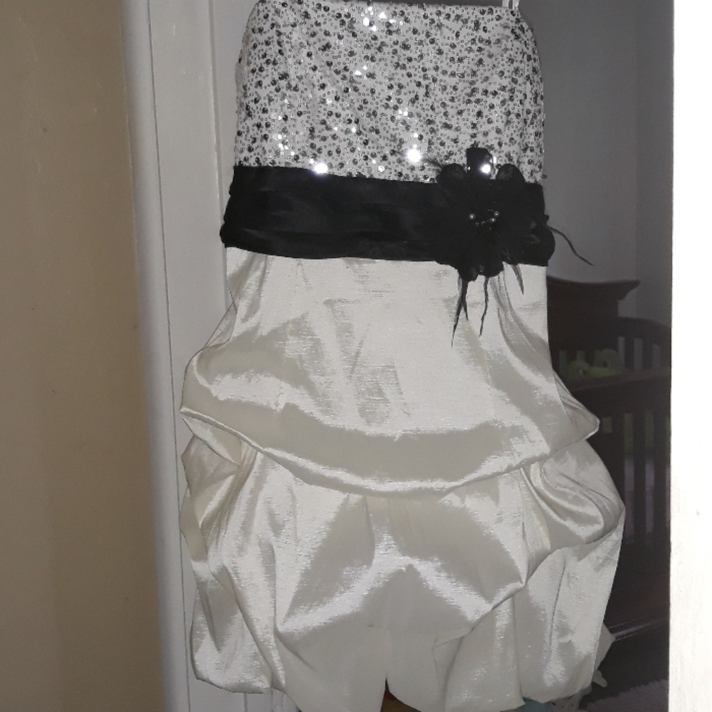 A short City Triangles prom dress with poofy skirt
